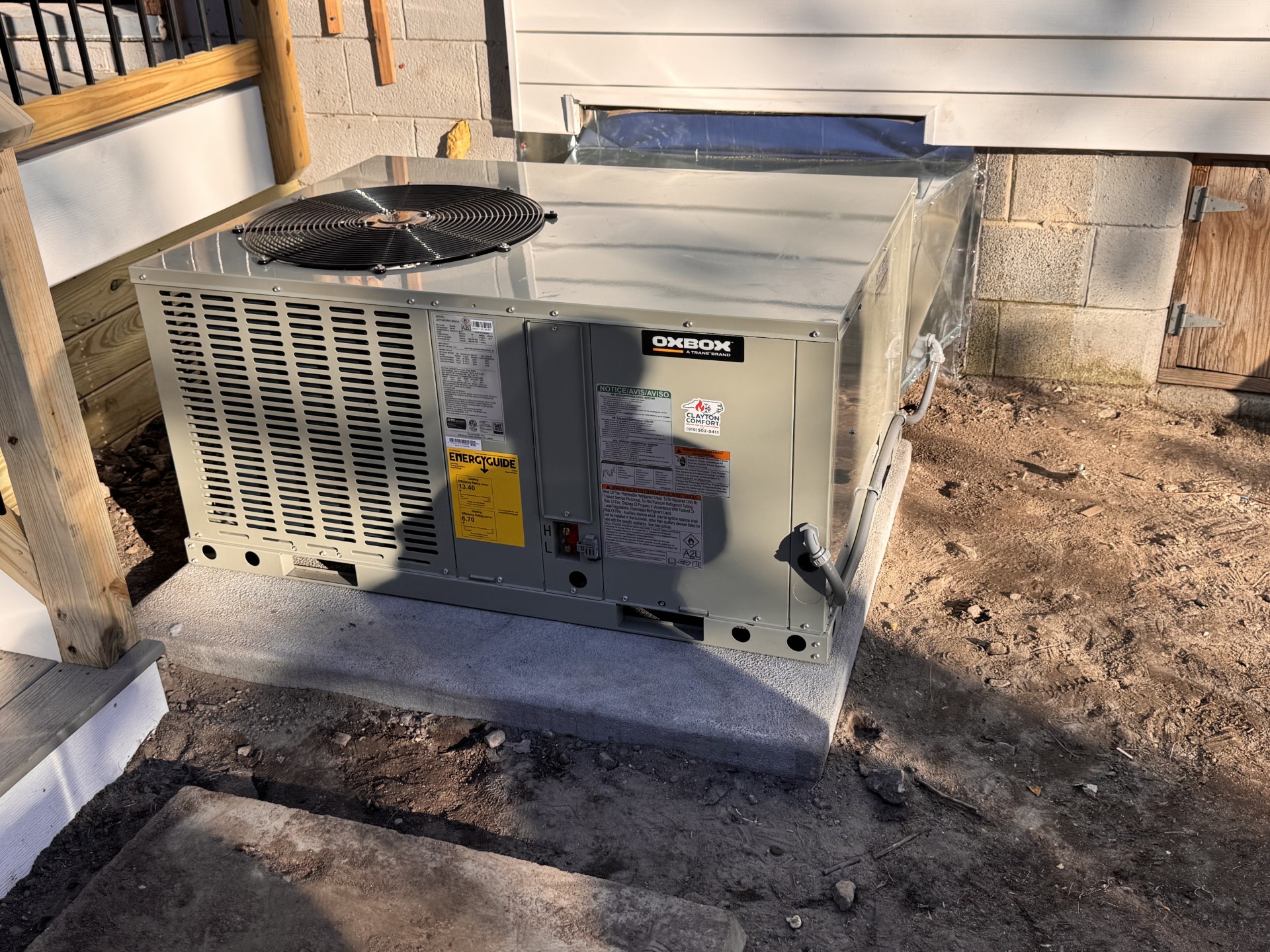 OXBOX packaged HVAC unit set on a new pad