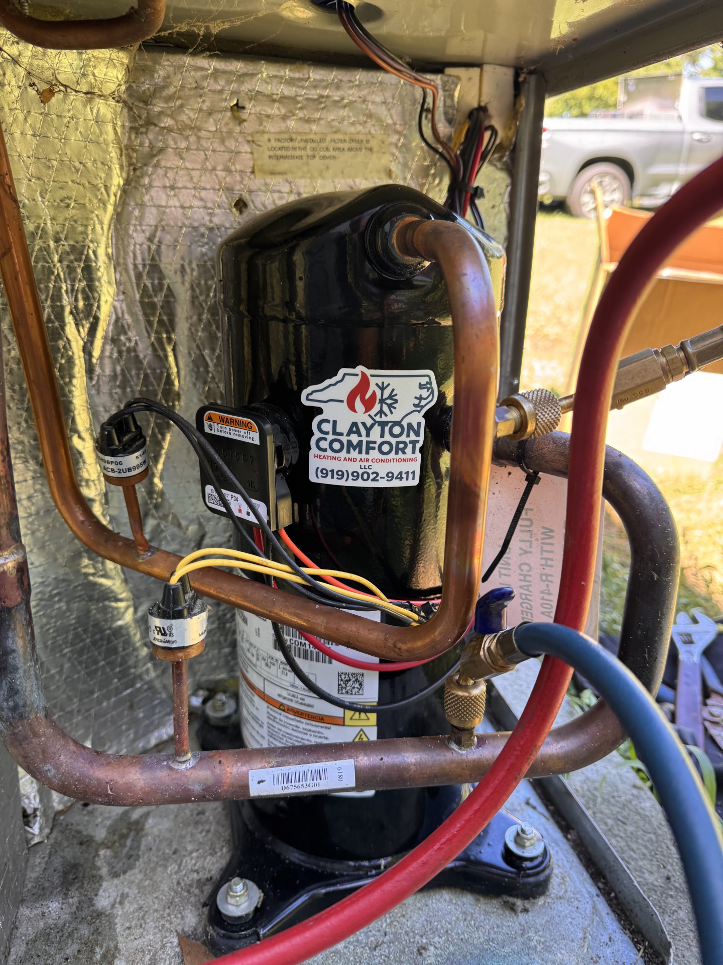 Compressor and refrigerant service connections during repair