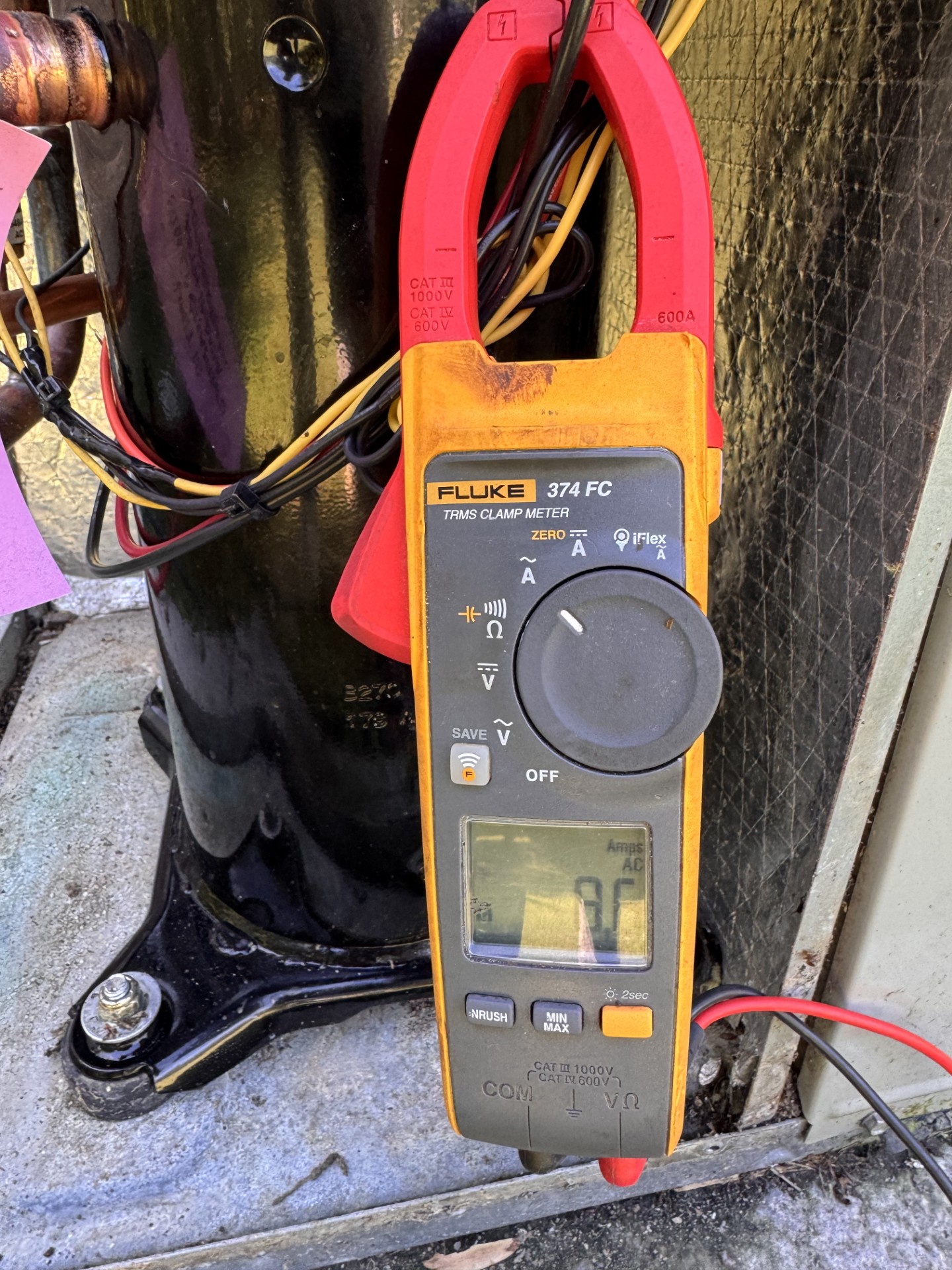 Clamp meter used to check an HVAC compressor circuit