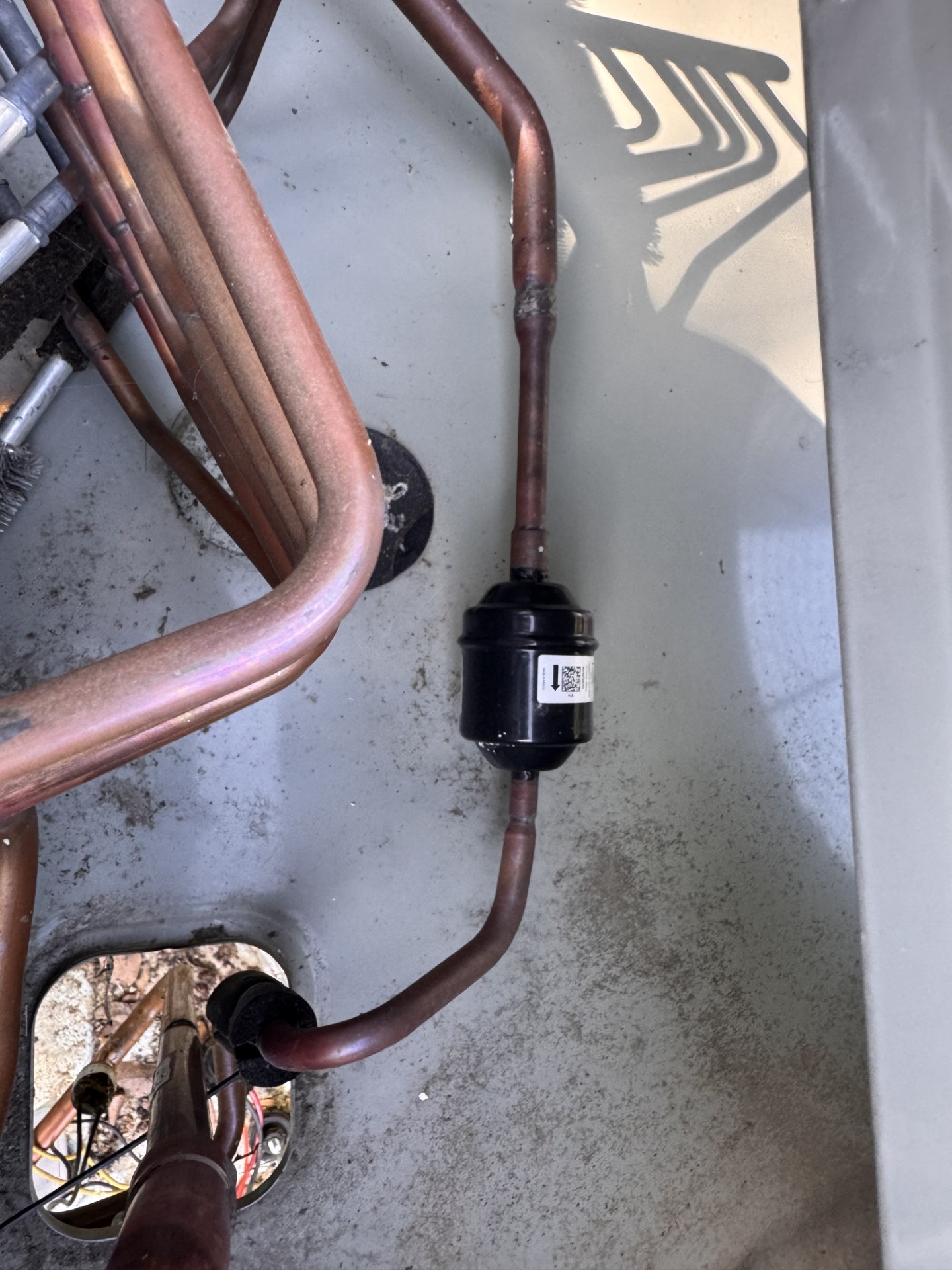 Refrigerant line and filter drier work inside an HVAC system