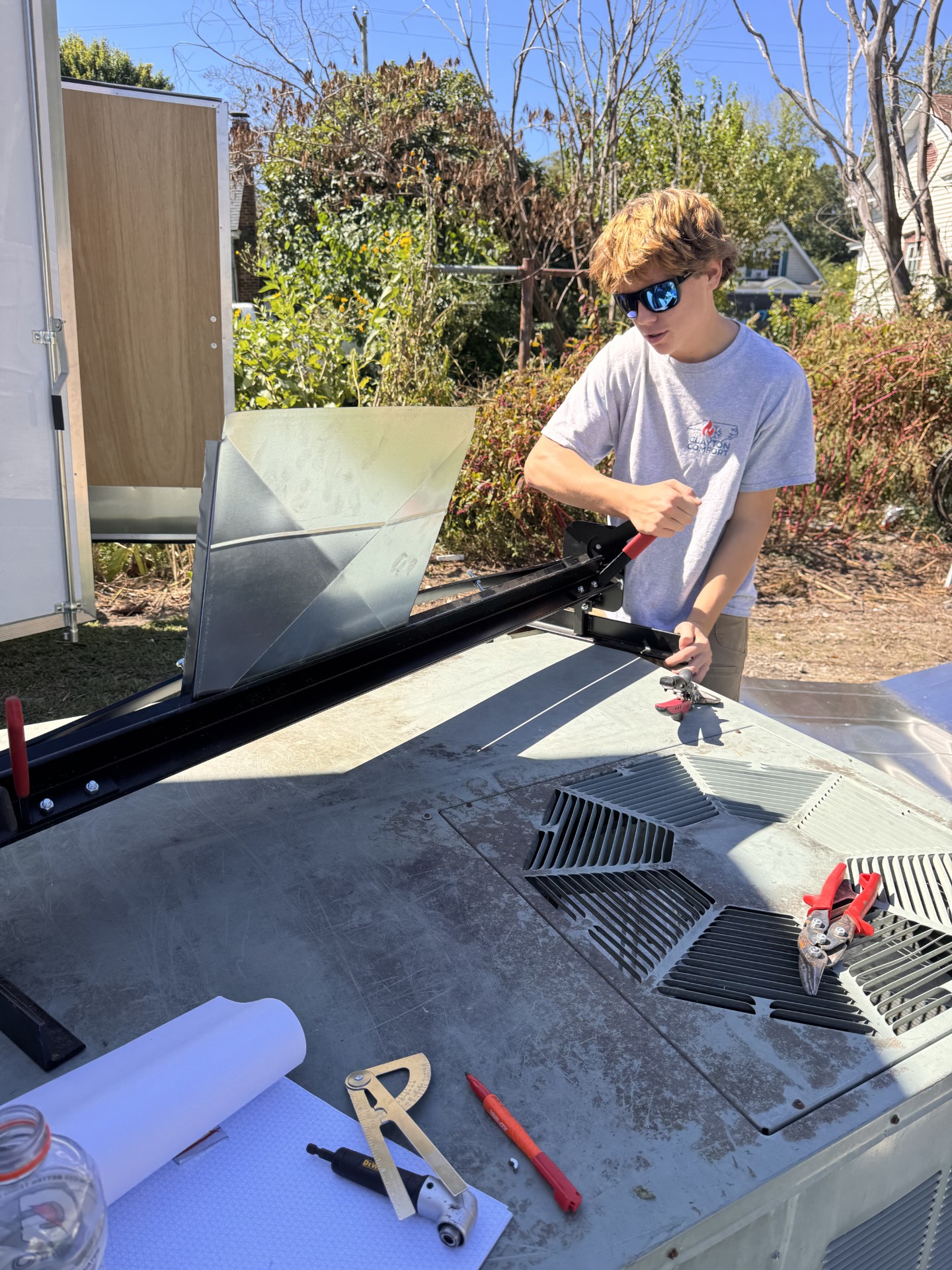 Clayton Comfort team member fabricating sheet metal on site
